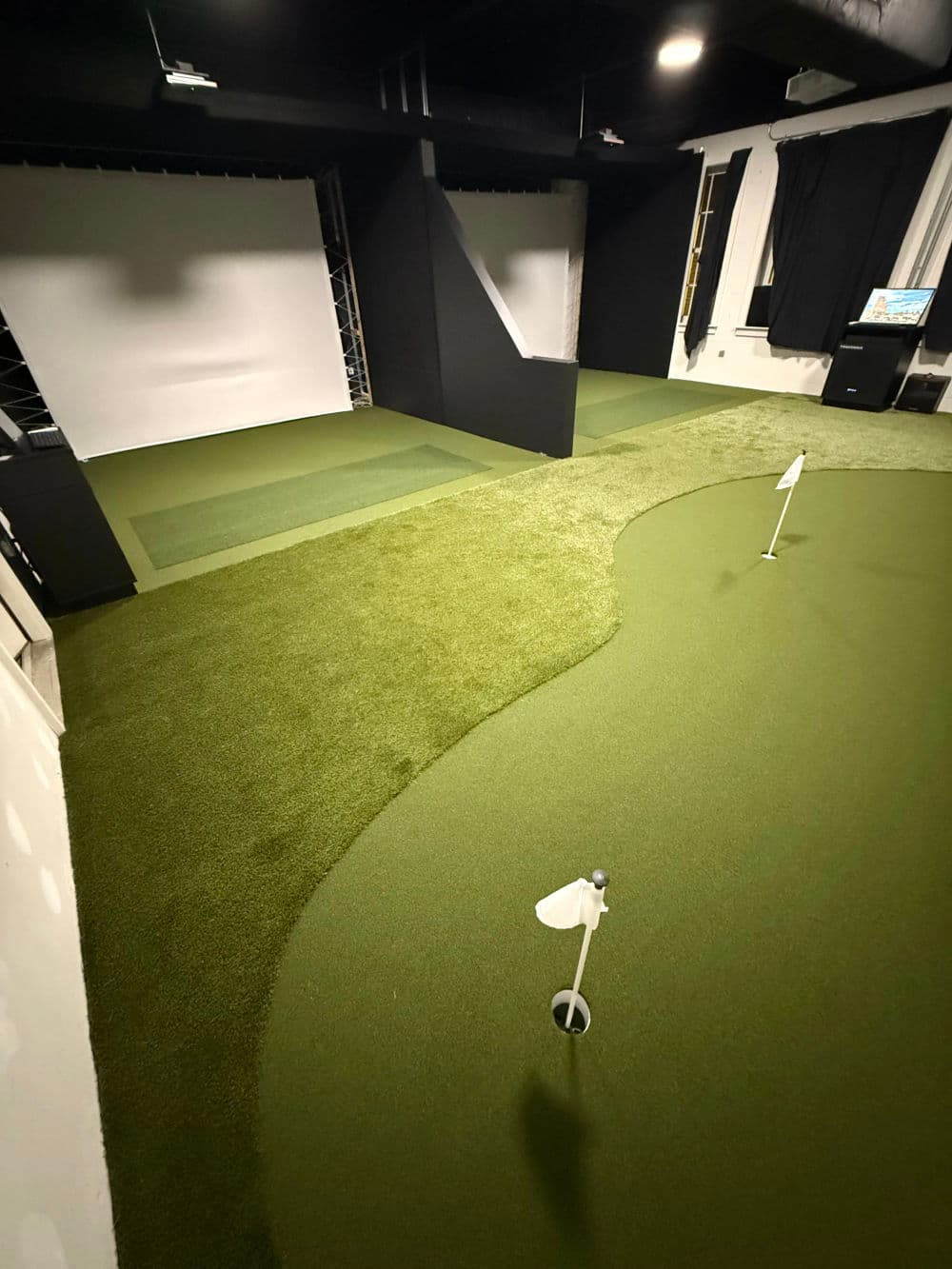 Indoor Golf Simulator Room with Putting Green in Winston-Salem